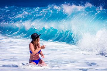 Wet Woman in Blue Bikini at the Sea and Splash of Waves
