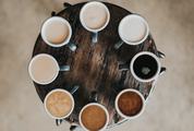 Eight Kinds of Coffee on a Round Wooden Table