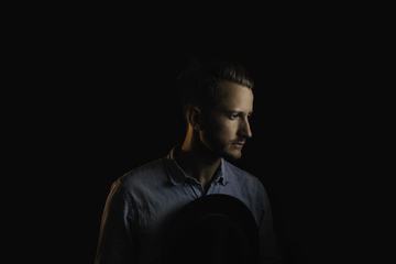 Pensive Man Profile Portrait on Dark Background