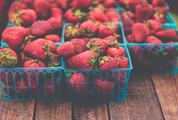 Fresh Strawberries in Boxes on Wooden Table