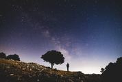 Man Watching the Amazing Starry Sky at Night