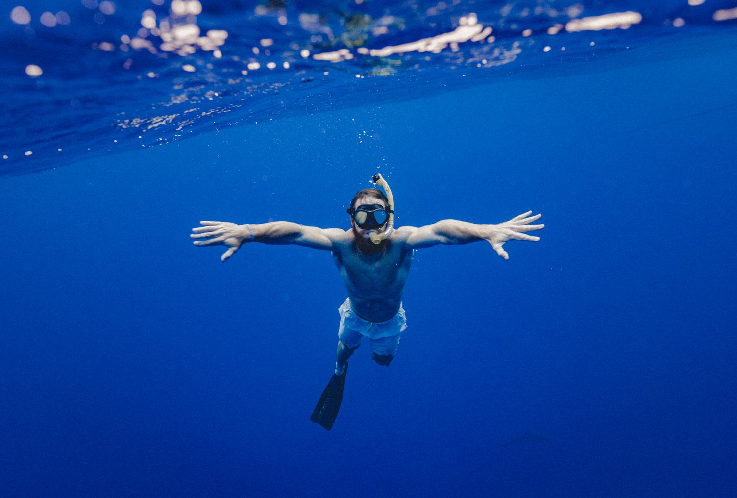 Man Snorkeling in Clear Water