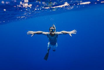 Man Snorkeling in Clear Water