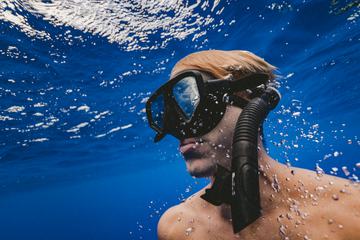 Man with Mask Diving in Clear Water