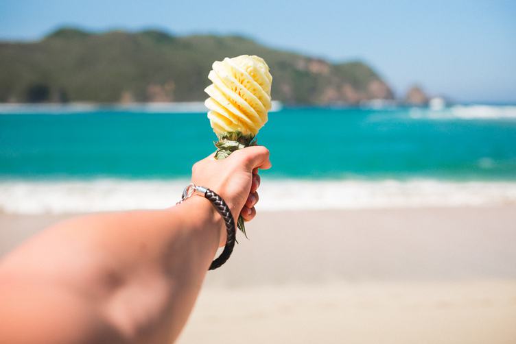 Hand Holding Pineapple Looking Like Ice Cream