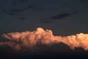 Cumulus Clouds against Dark Sky