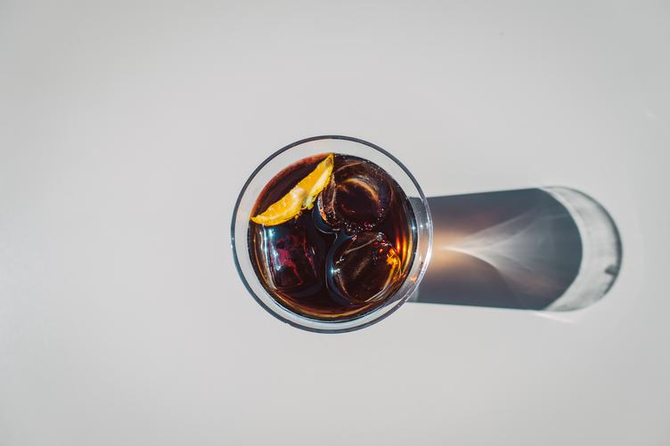 Cola in Glass with Ice Top View
