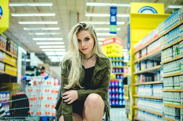 Portrait of Woman Looking at a Camera in a Supermarket