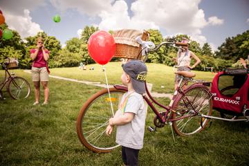 Little Boy with Red Balloon in Park