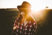 Smiling Brunette in Checkered Shirt