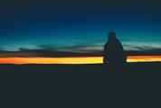 Silhouette of Lonely Person at Sunset