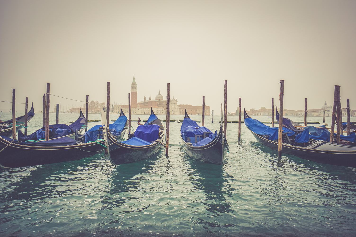 Gondolas Moored by Saint Mark Square with San Giorgio Di Maggiore Church in Venice, Italy