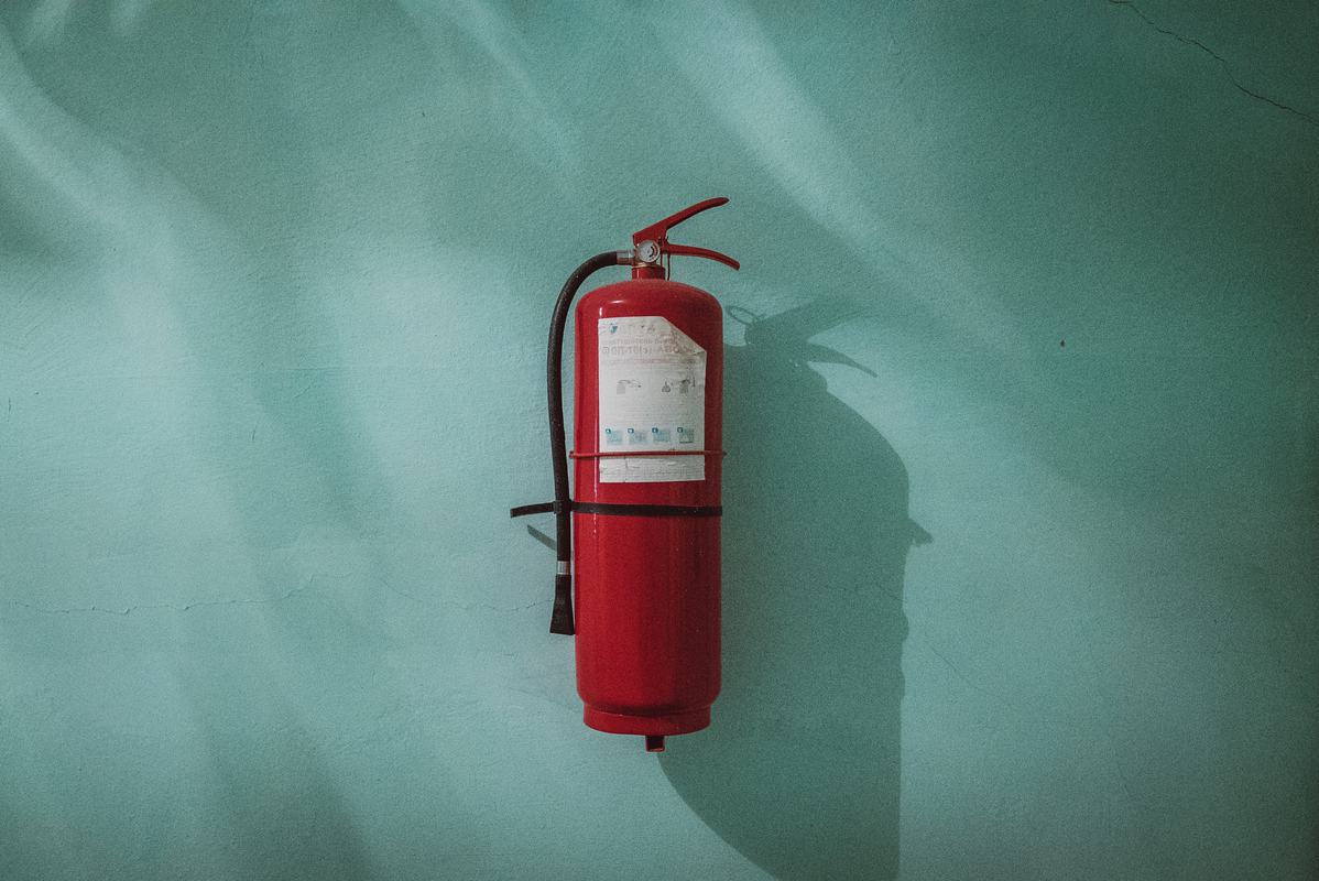 Free Photo: Fire Extinguisher on the Celadon Wall