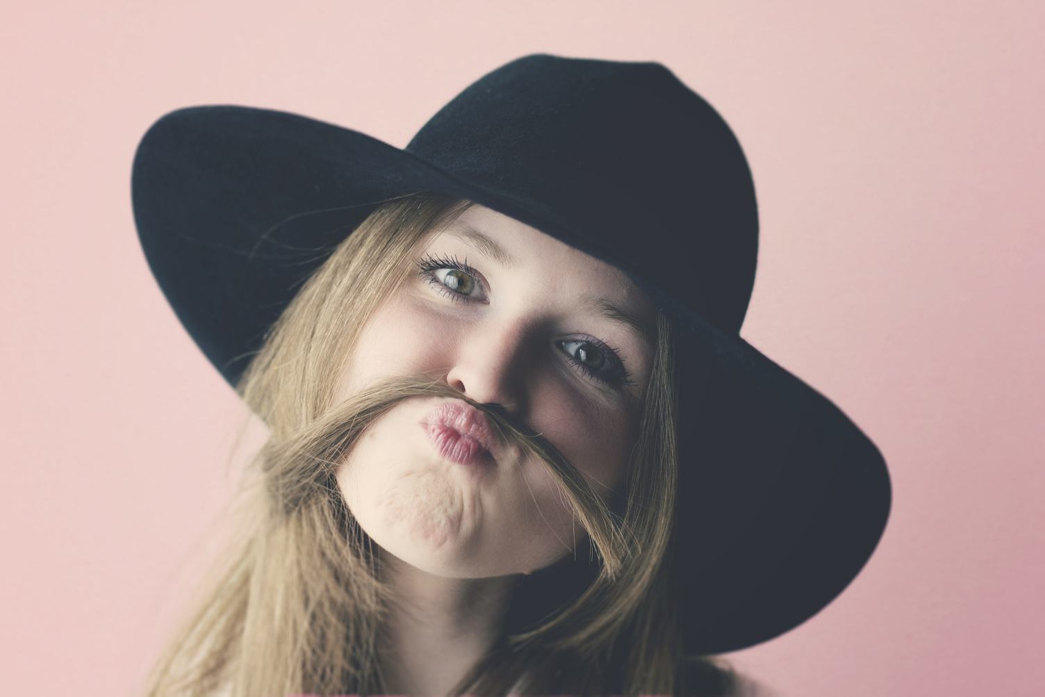 Portrait of Young Girl with Moustache Made of Hair