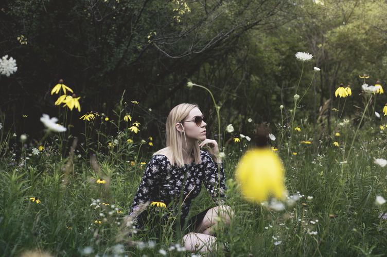 Pensive Woman in Meadow