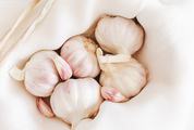 Garlic Cloves and Bulbs in a White Cloth