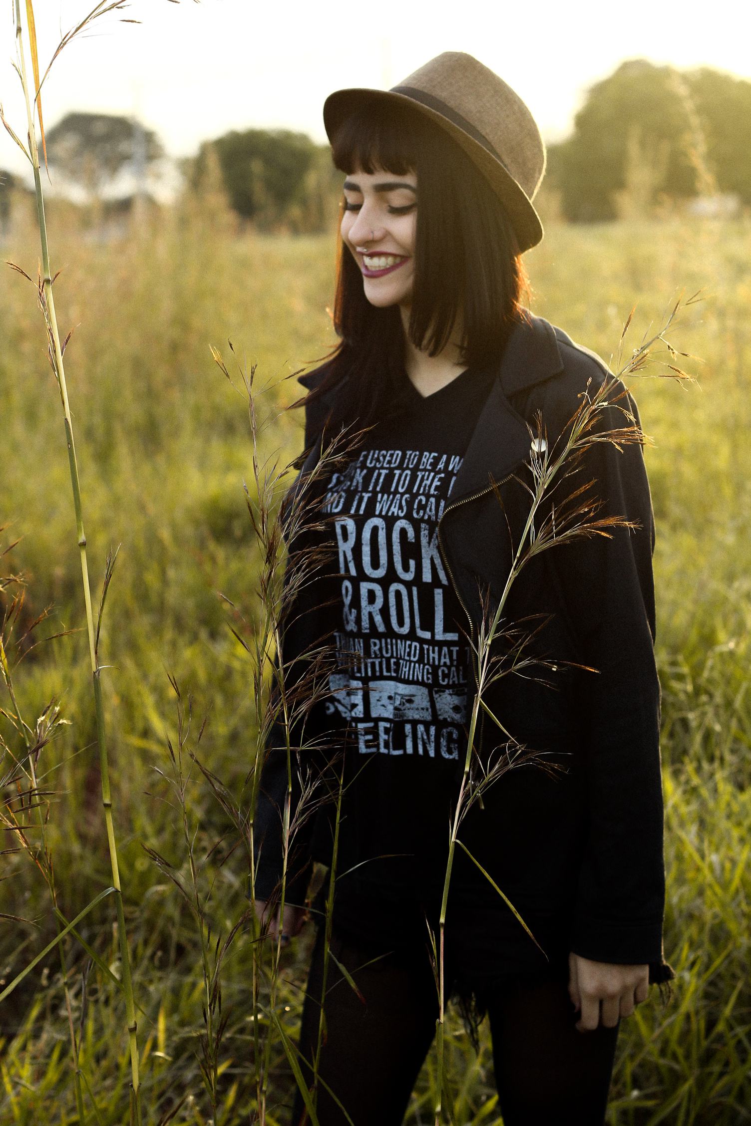 Cheerful Girl in Hat Walking in the Meadow