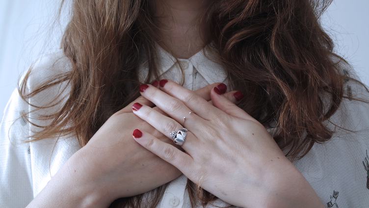 Woman with Red Nails and Silver Rings
