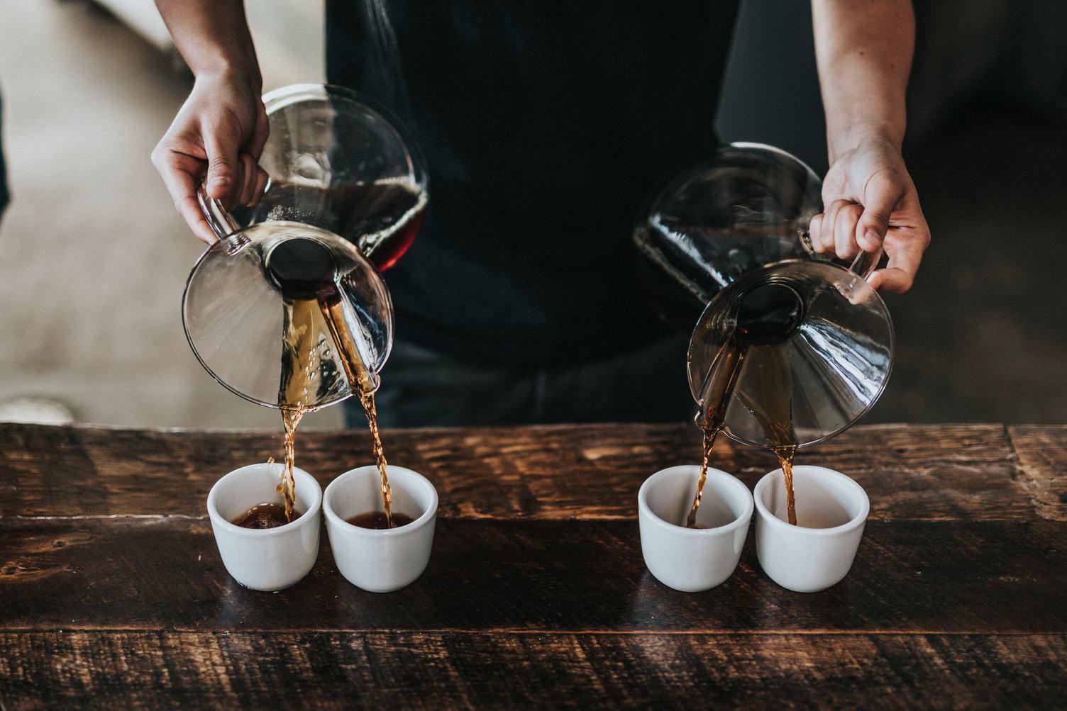 Professional Barista Serves Hand Brewed Coffee