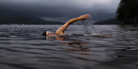 Man Swimming the Front Crawl in a Lake