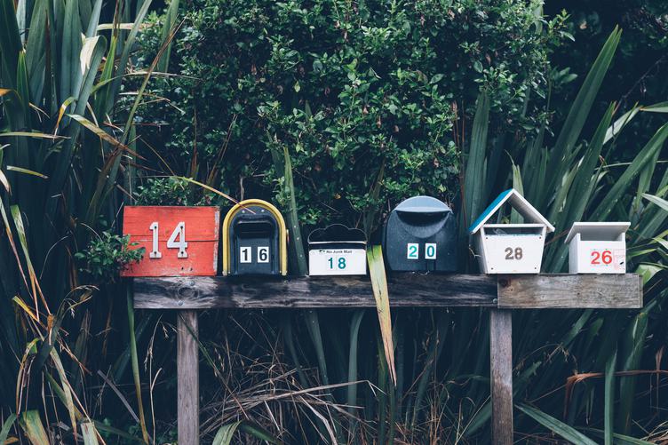 Six Various Mailboxes Different Colors and Shapes