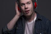 Portrait of Young Man with Red Headphones