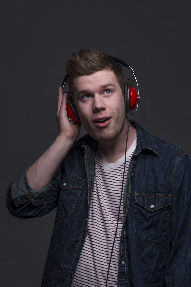 Portrait of Young Man with Red Headphones