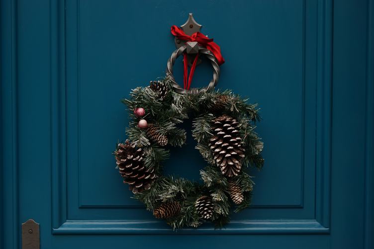 Christmas Wreath Hanging on Turquoise Wooden Door