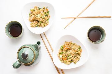 Chicken Fried Rice Served with Tea, Flatlay on White