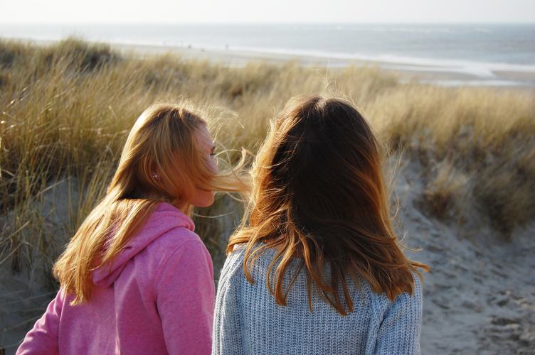 Two Girls Sitting on the Dune