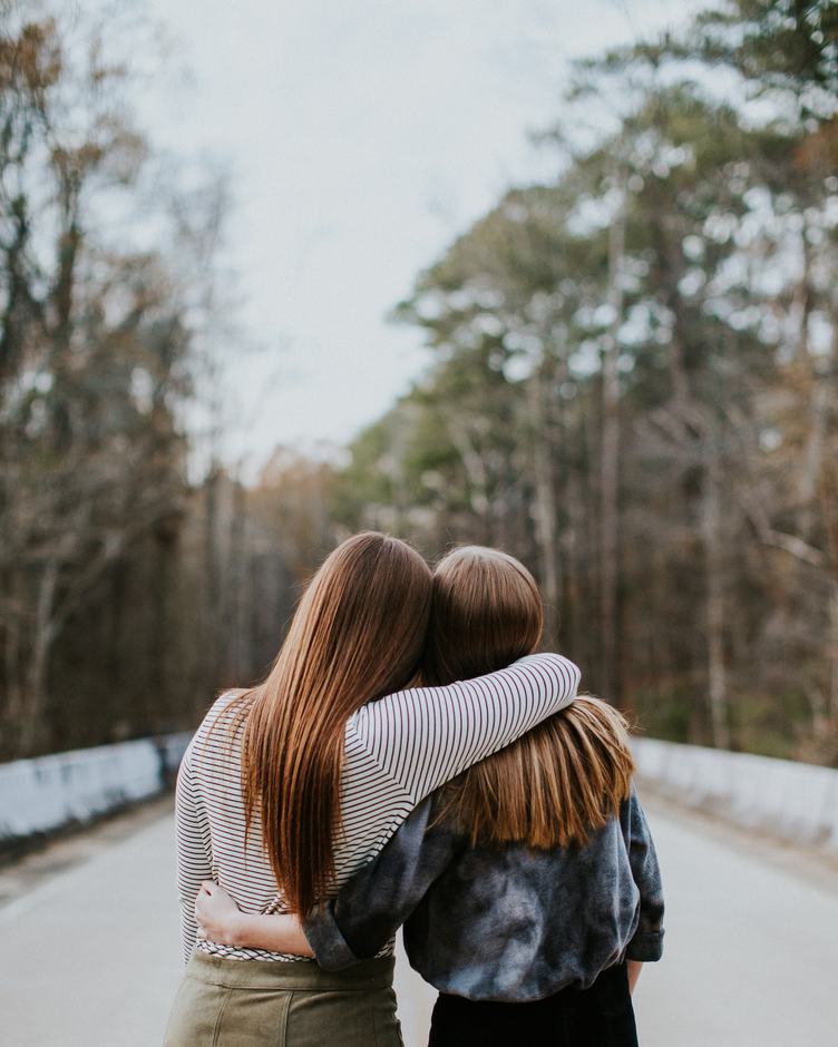 Free Photo Back View Of Two Girls Hugging