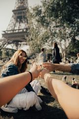 Friends Drink Champagne near Eiffel Tower