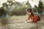 Little Asian Girl Playing with Sand