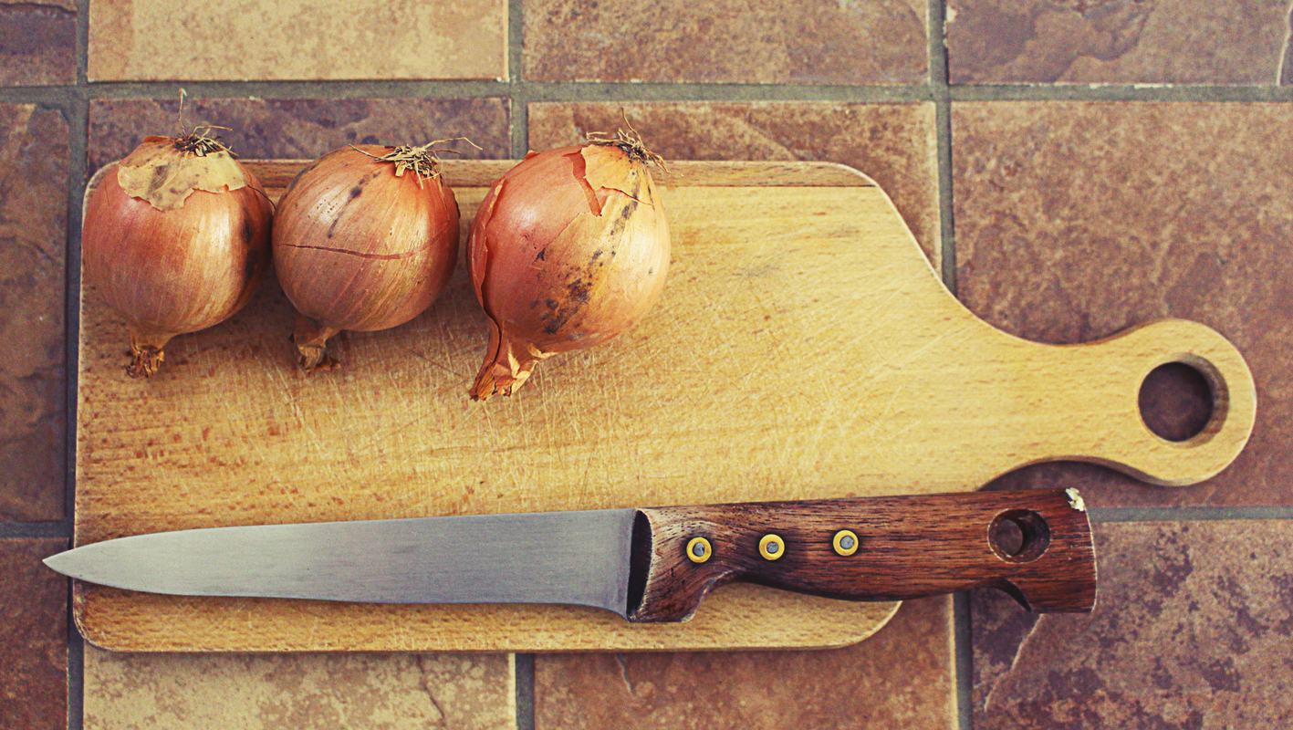 Free Photo Onions on Wooden Cutting Board