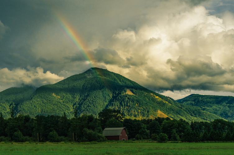 Landscape with Green Hills and Rainbow