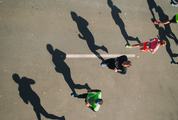 Marathon Runners and Their Shadows