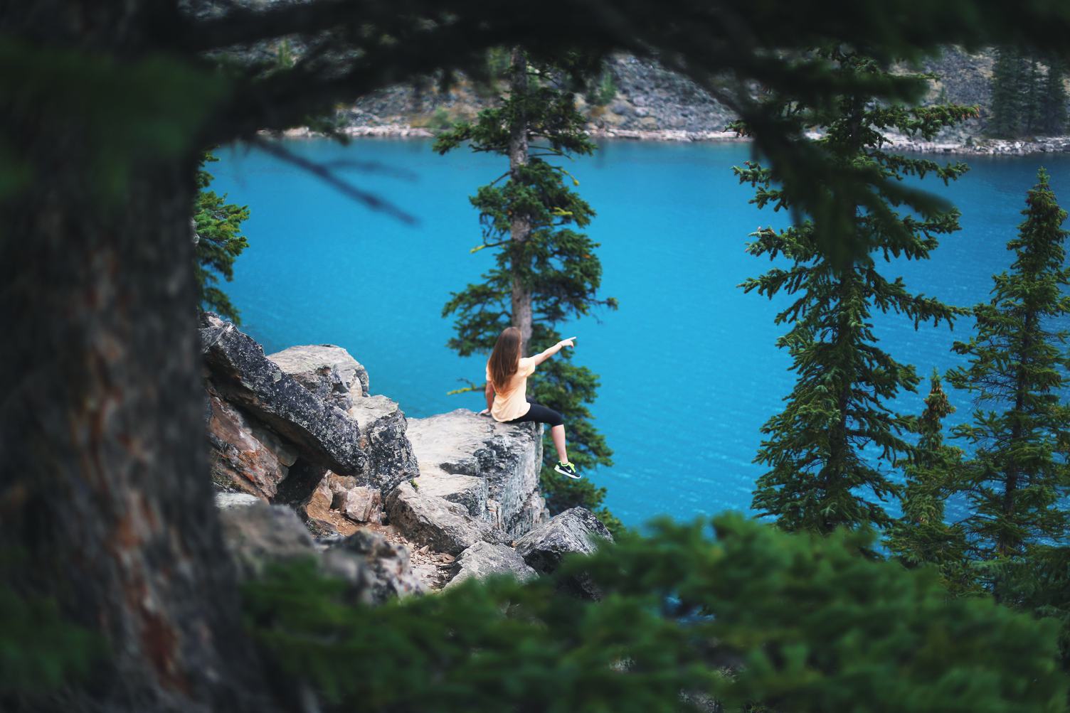 Girl Pointing at Moraine Lake Canada