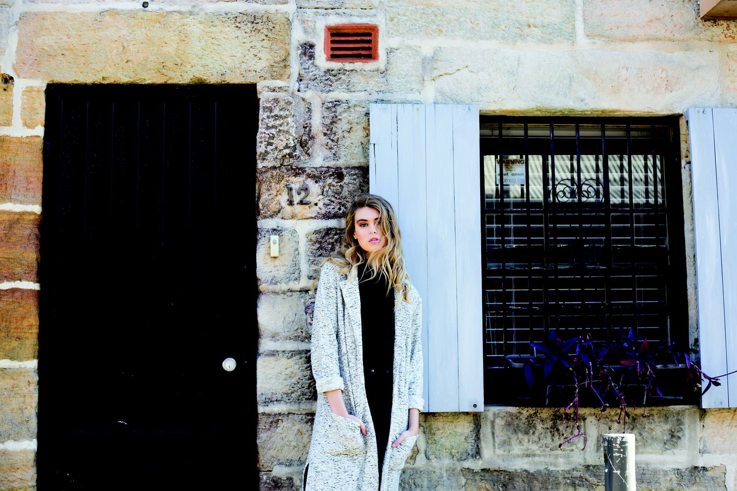 Woman Standing in Front of Old Building
