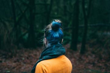 Woman with Blue Hair Standing Back
