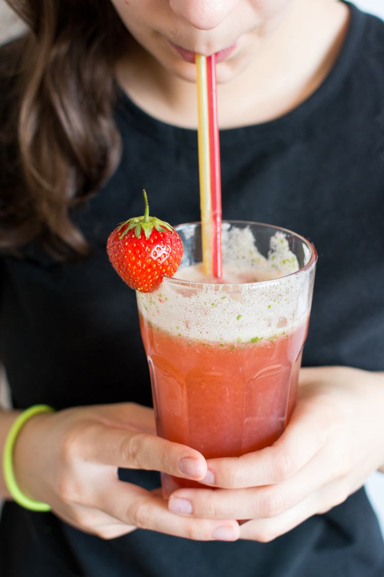 Woman Drinking Homemade Fresh Strawberry Lemonade