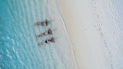 Top View of Three Woman in Water on the Beach