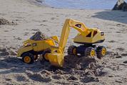 Excavator and Tipper Toys on the Beach Working with Sand