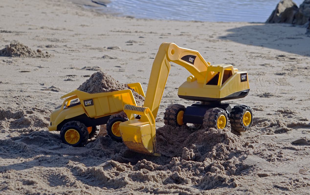 Free Photo: Excavator and Tipper Toys on the Beach Working with Sand