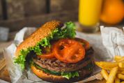 American Style Burger with French Fries and Orange Juice