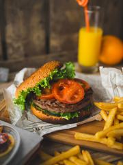 American Style Burger with French Fries and Orange Juice