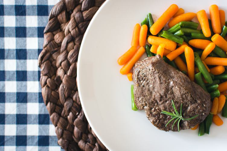 Top View of Steak with Mini Carrots and Green Beans