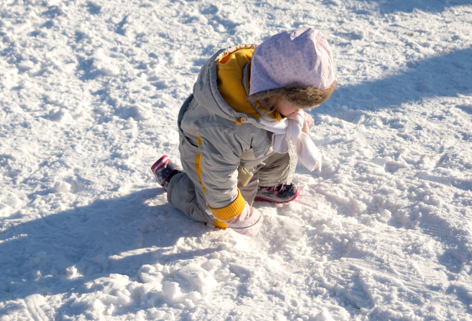 Child Playing on Snow