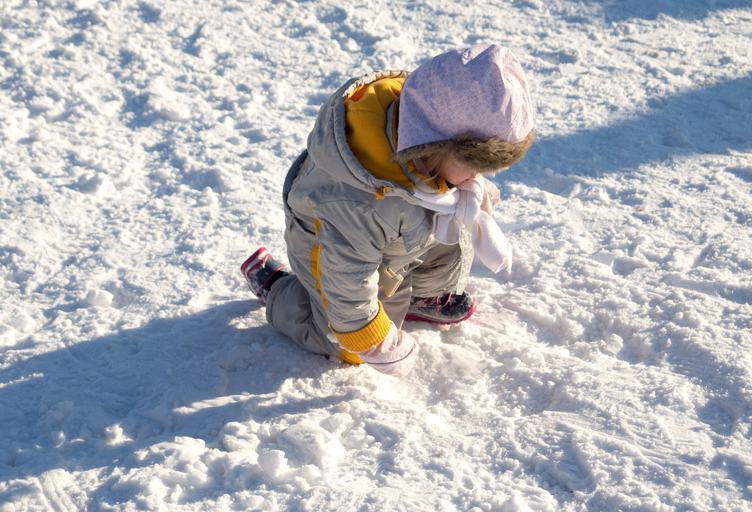 Child Playing on Snow