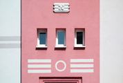 Pastel Pink Building with Small Windows