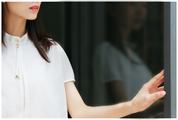 Young Woman Standing Wearing White Shirt